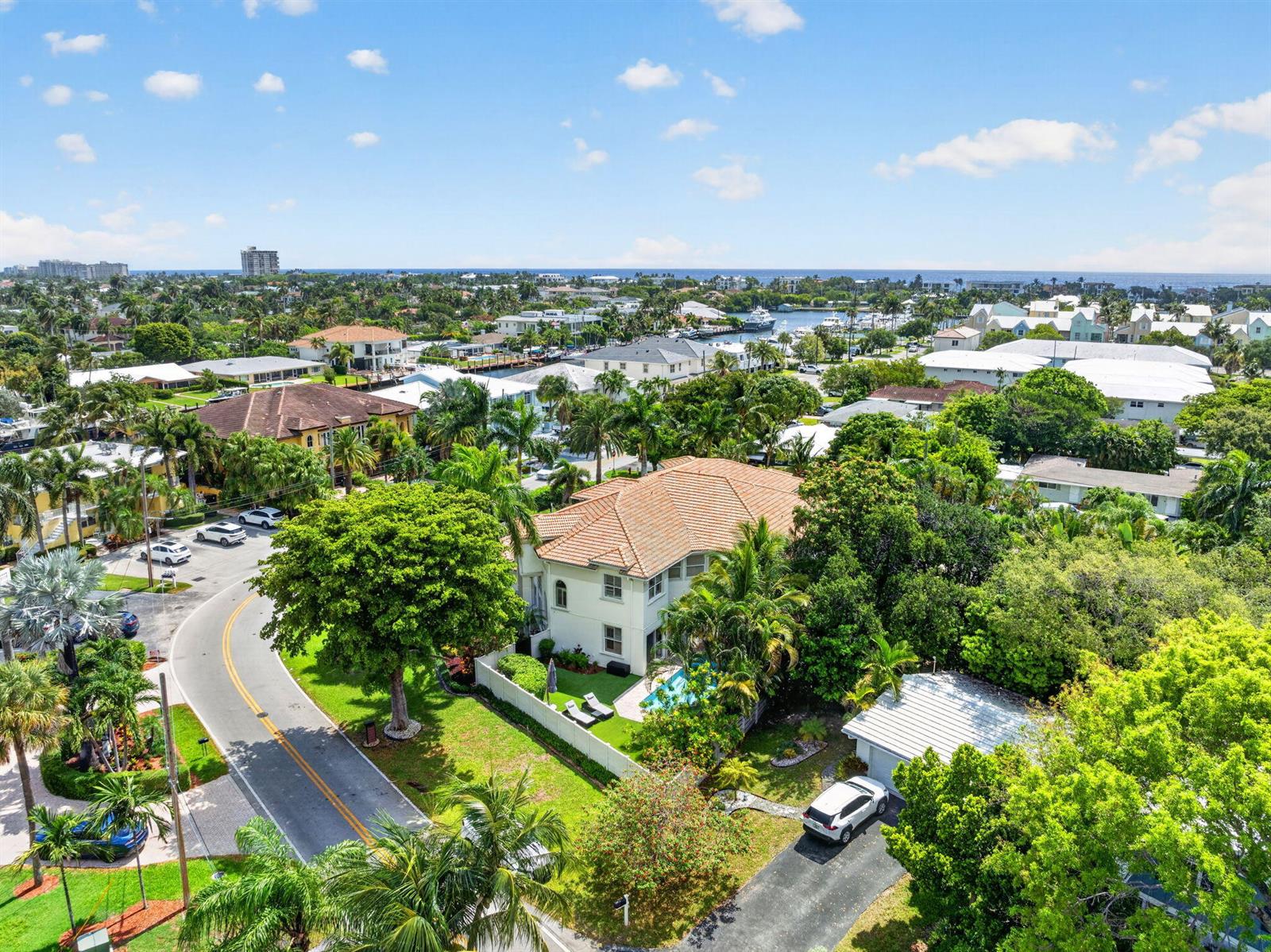 An aerial view shows a two-story house with a tiled roof, pool, and surrounding tropical landscaping — 2844 NE 26th Avenue, Lighthouse Point FL 33064, LIGHTHOUSE POINT, FL