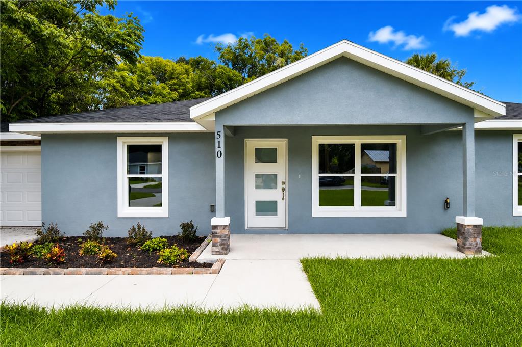 A single-story house with a gray exterior, white trim, and a covered front porch — 510 SW 15 AVENUE, OCALA, FL
