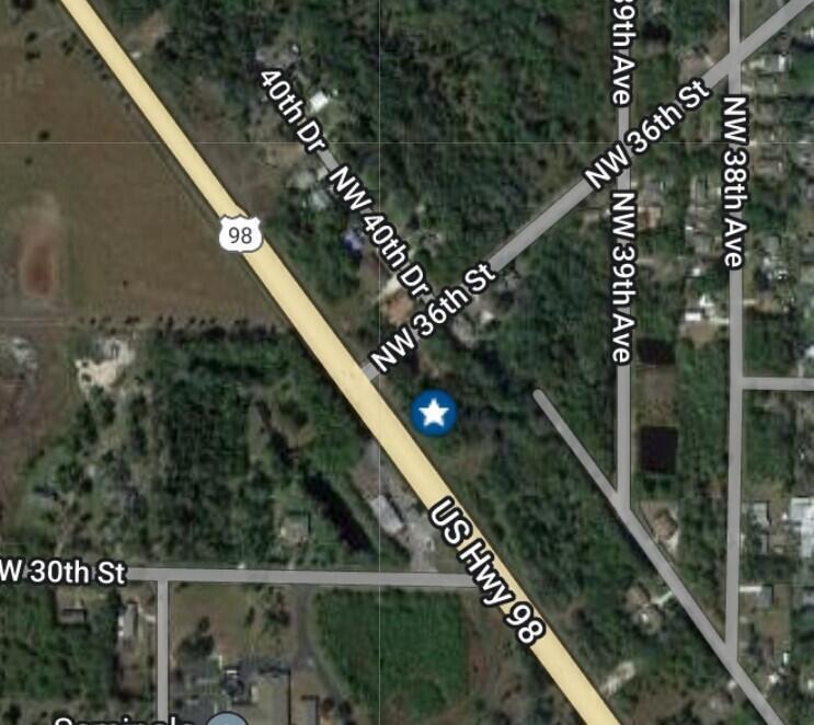 This is a satellite map view showing a road intersection near US Highway 98 — 3128 U.s. 98, Okeechobee FL 34972, OKEECHOBEE, FL