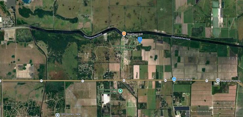 This is an aerial map showing the location of a property near the Caloosahatchee Canal — 1095 RIGHT SIDE ROAD, MOORE HAVEN, FL