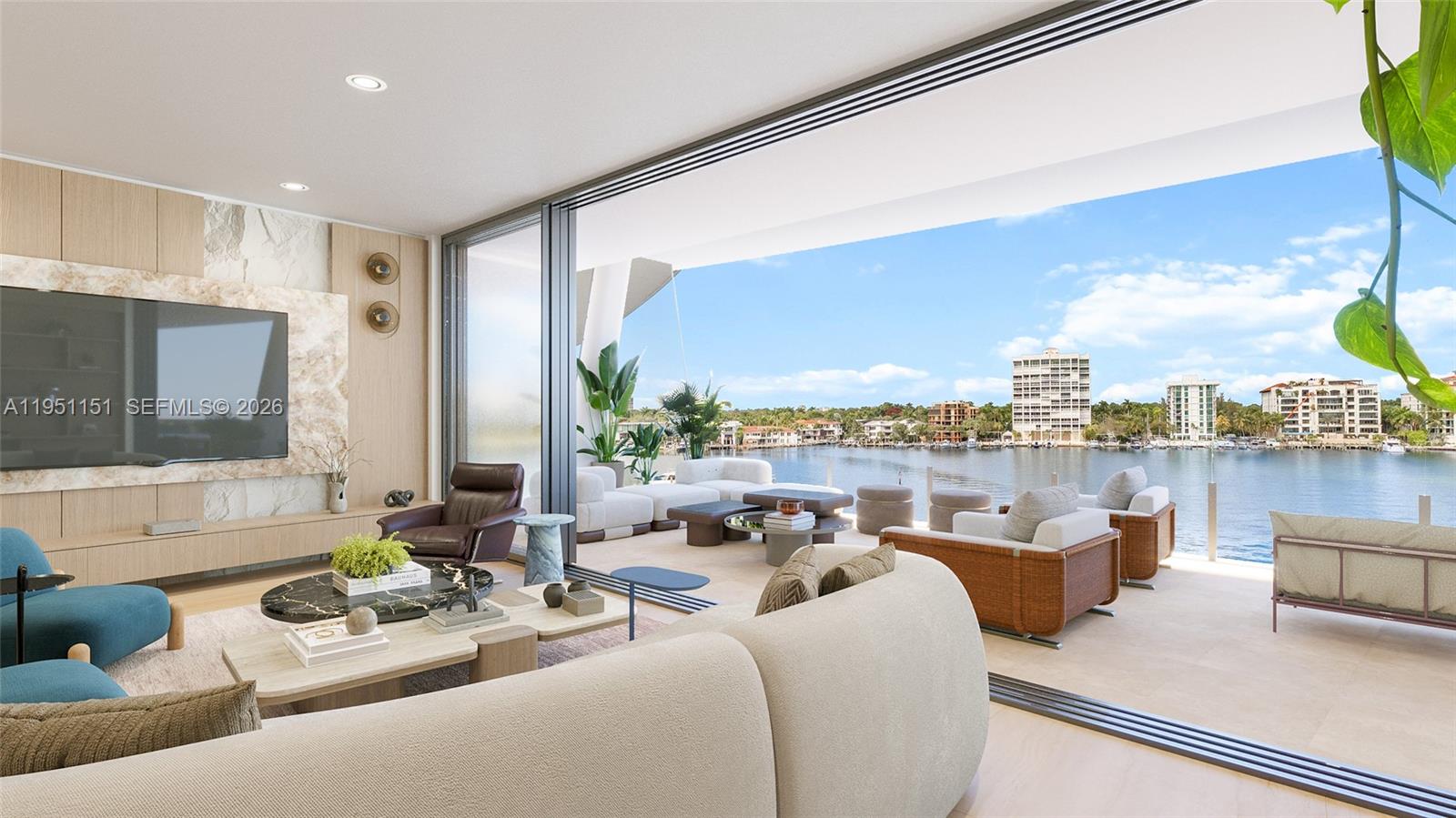 A modern living room opens to a balcony overlooking a waterfront with distant buildings — 5 Grove Isle # S301, Coconut Grove FL 33133, COCONUT GROVE, FL