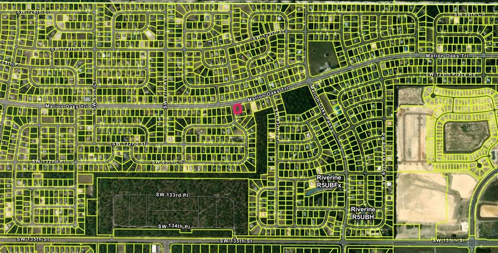 This is a satellite map showing a residential neighborhood with highlighted property boundaries — LOT 29 MARION OAKS TRAIL, OCALA, FL