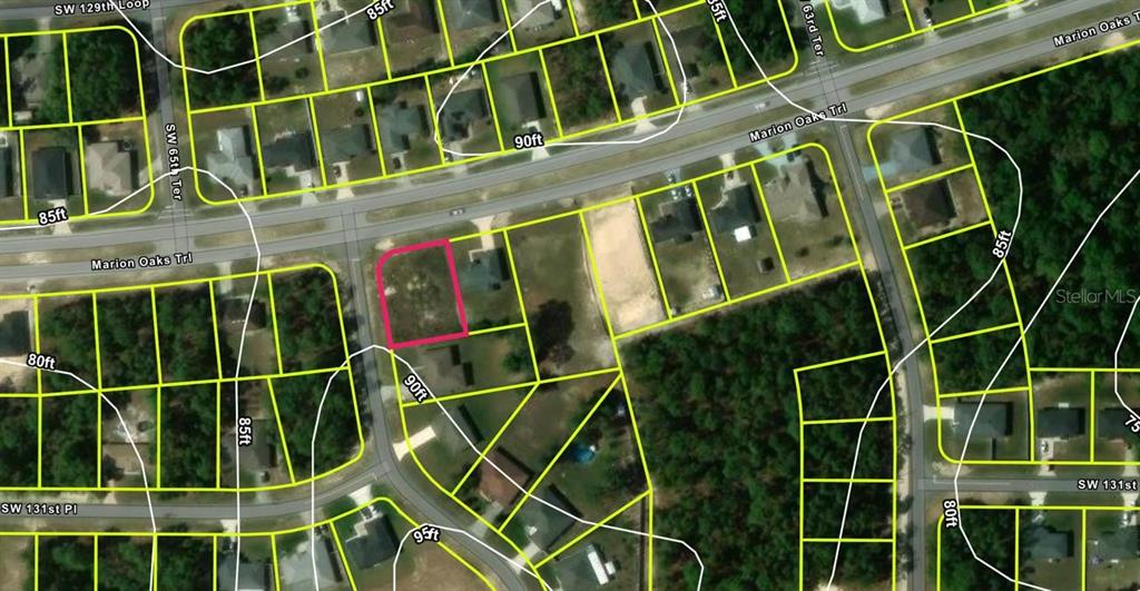 This is an aerial map showing a vacant lot highlighted in pink within a residential neighborhood — LOT 29 MARION OAKS TRAIL, OCALA, FL