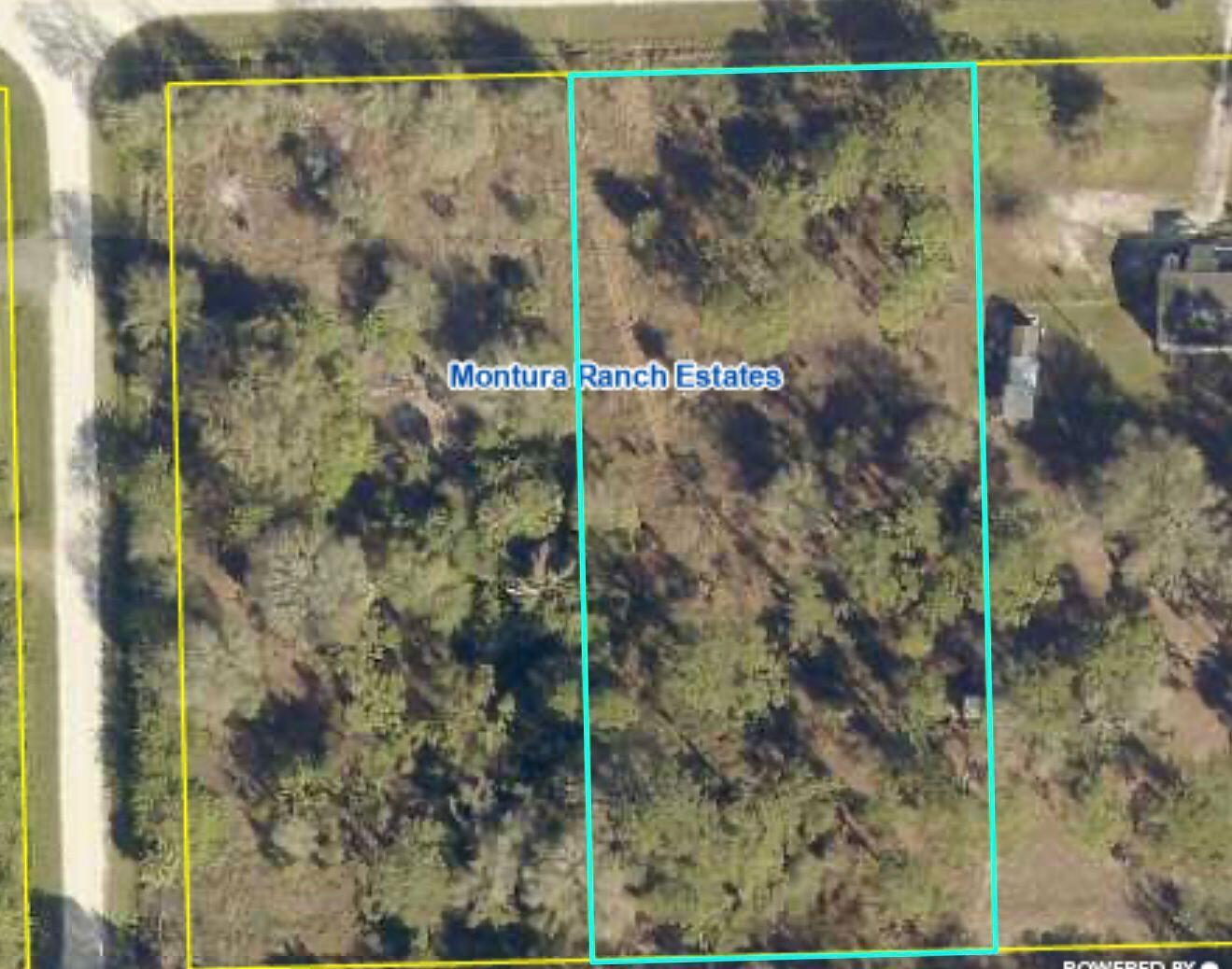 An aerial view shows two adjacent, wooded rectangular lots in Montura Ranch Estates — 756 Siboney Ave Street, Clewiston FL 33440, CLEWISTON, FL