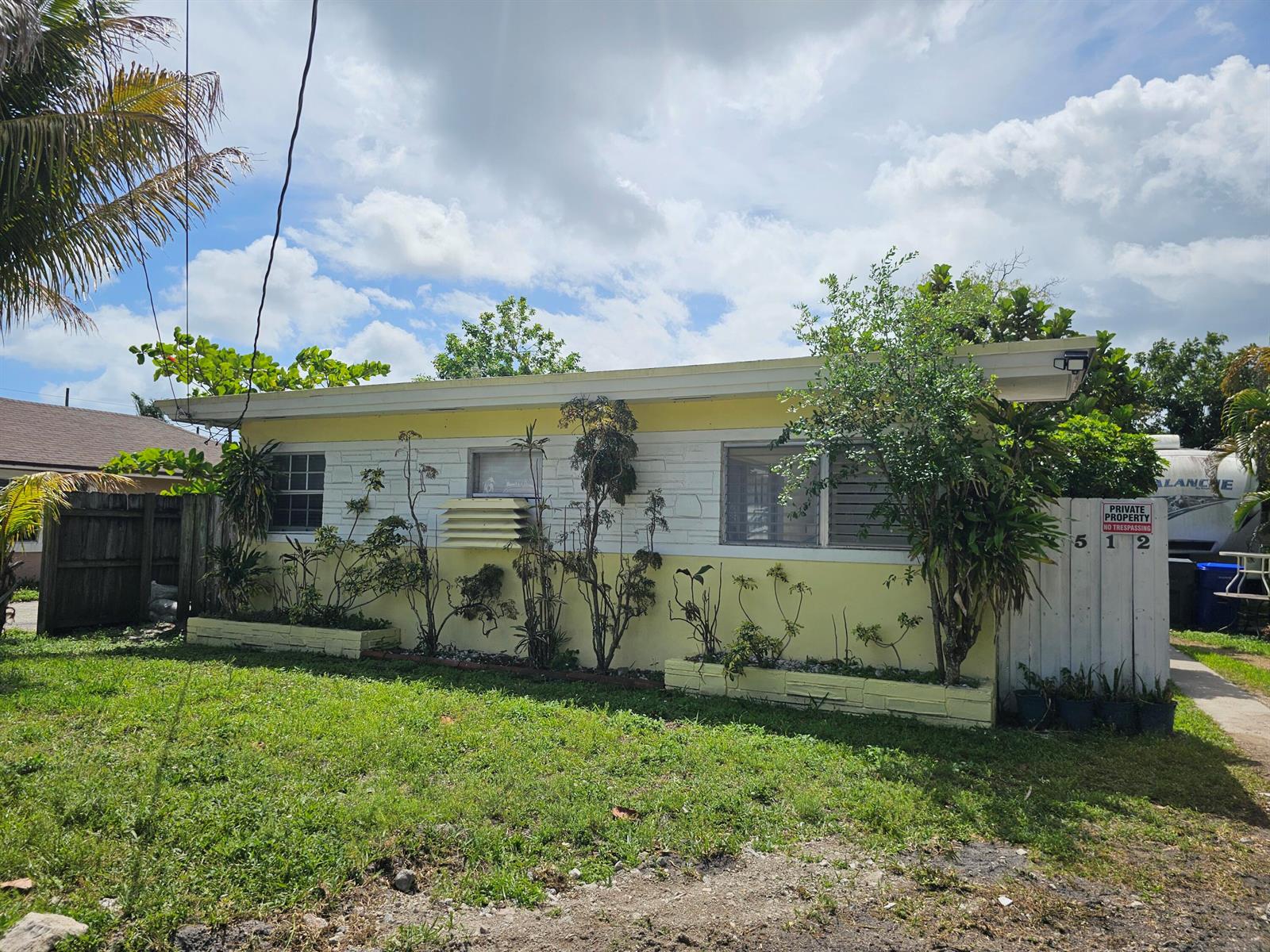 A single-story yellow house with a flat roof and a small front yard — 2512 Arthur Street, Hollywood FL 33020, HOLLYWOOD, FL