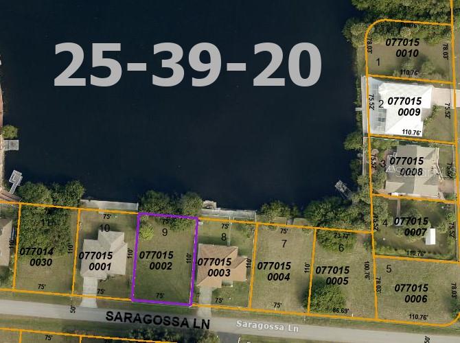 This is a map showing property lot lines and parcel numbers along a lake — SARAGOSSA LANE, NORTH PORT, FL