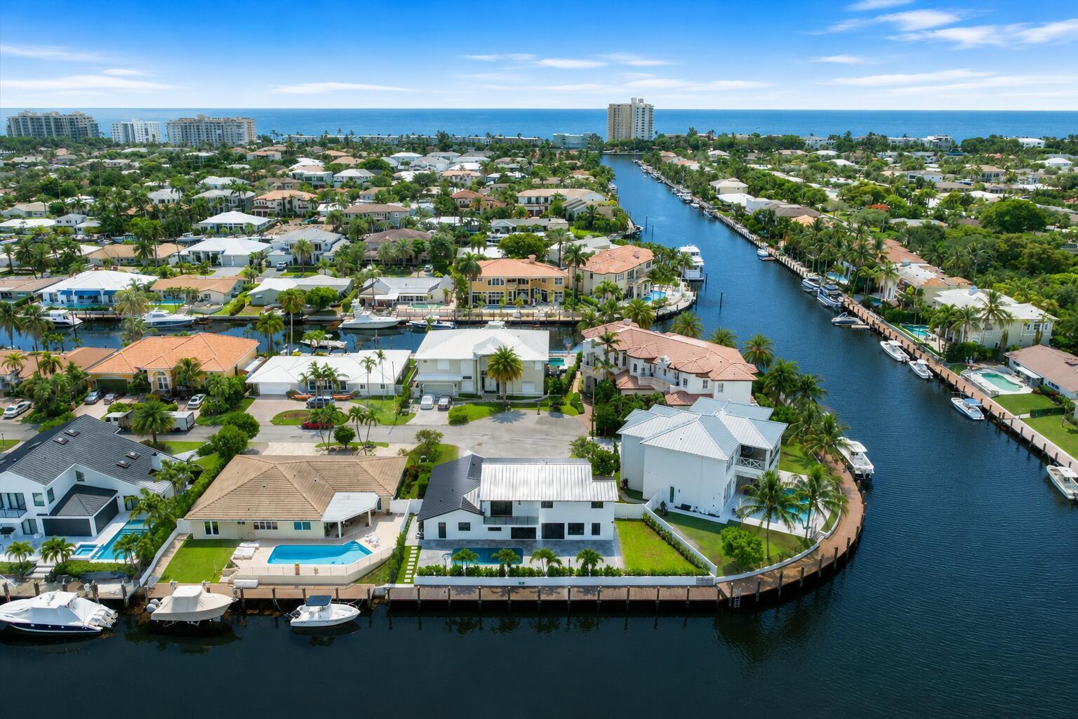 An aerial view of waterfront homes with private docks and swimming pools along a canal — 3711 NE 27th Avenue, Lighthouse Point FL 33064, LIGHTHOUSE POINT, FL