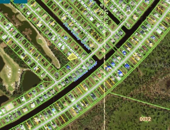 This is an aerial map showing a vacant residential lot highlighted in yellow — 4 TOURNAMENT ROAD, ROTONDA WEST, FL