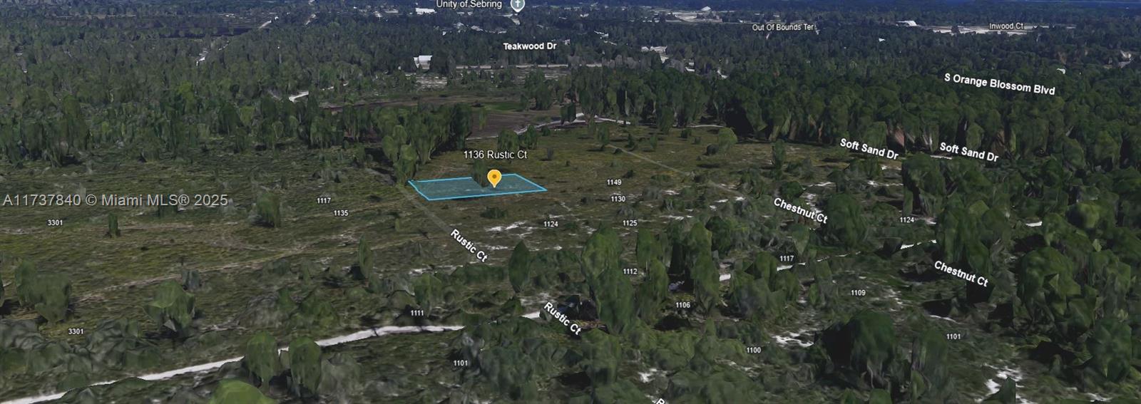 An aerial view shows a highlighted vacant residential lot surrounded by trees and neighborhood streets — 1136 Rustic Court, Sebring FL 33852, SEBRING, FL