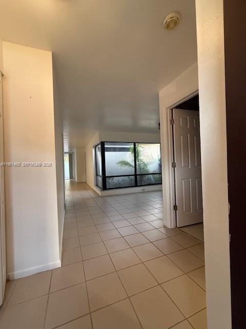 The exterior view shows the side of a multi-story residential building with a tiled roof — 13371 SW 89th Ter # F, Miami FL 33186, MIAMI, FL