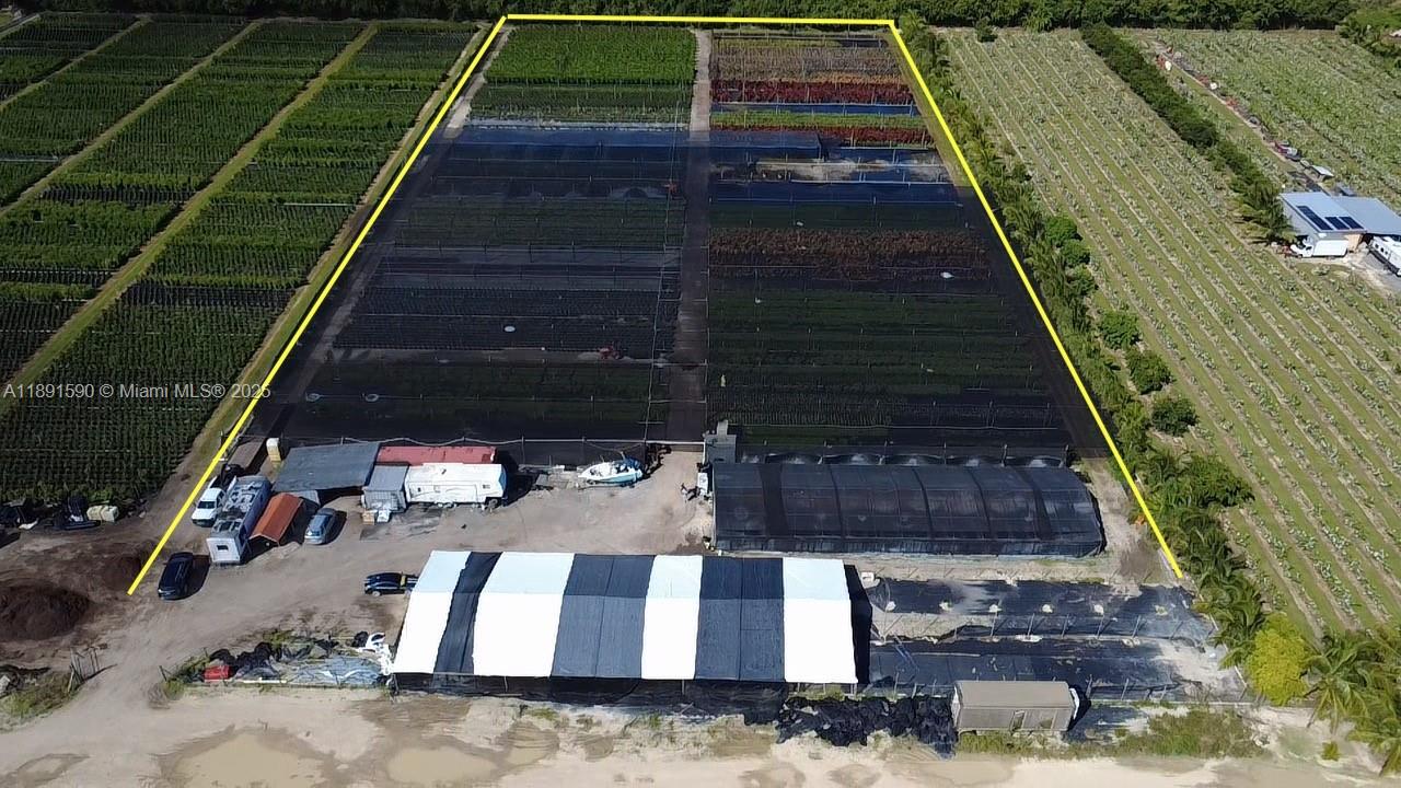 An aerial view shows a commercial plant nursery with shade structures and outdoor growing areas — krome, Homestead FL 33034, HOMESTEAD, FL
