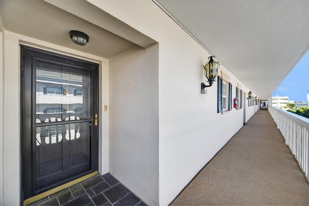 This is a floor plan for a residential unit featuring three bedrooms and two bathrooms — 131 BLUFF VIEW DRIVE UNIT 403, BELLEAIR BLUFFS, FL