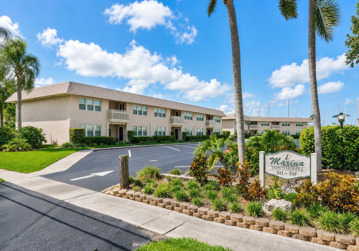 A two-story apartment building with a parking lot and a sign for Marina Townhomes — 321 Gulfstream Road, Dania Beach FL 33004, DANIA BEACH, FL