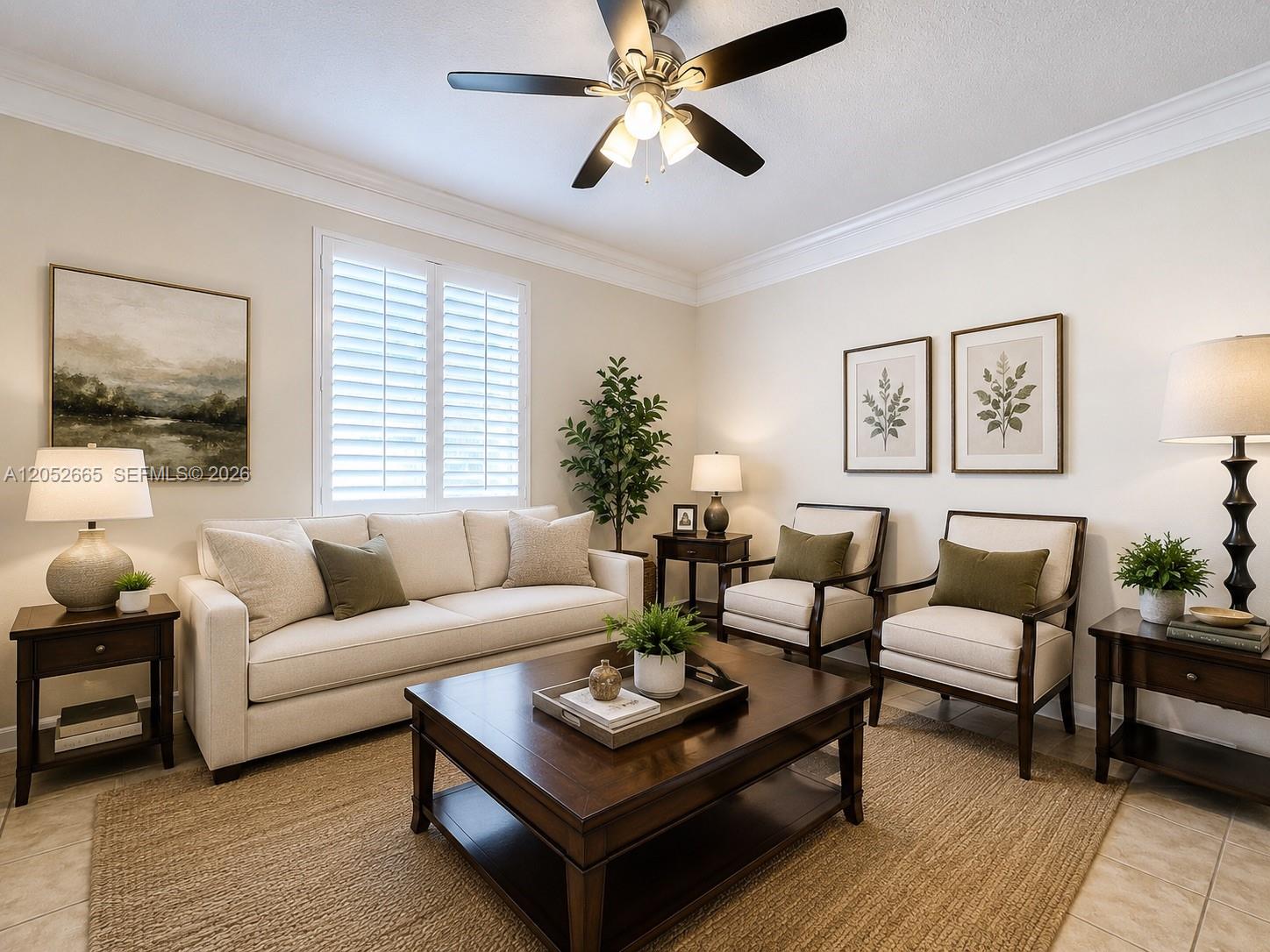 A living room features a beige sofa, two armchairs, a coffee table, and a ceiling fan — 125 Galicia Way # 204, Jupiter FL 33458, JUPITER, FL