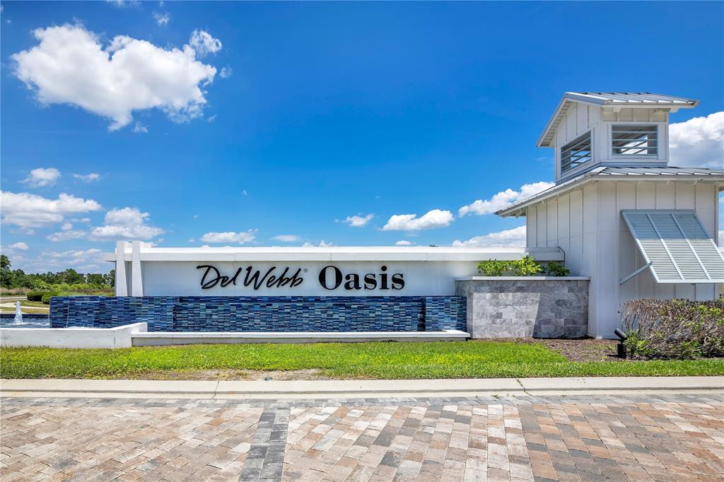 A kitchen and dining area with wooden cabinets, stainless steel appliances, and a wooden table — 15157 AQUA SOL LANE, WINTER GARDEN, FL