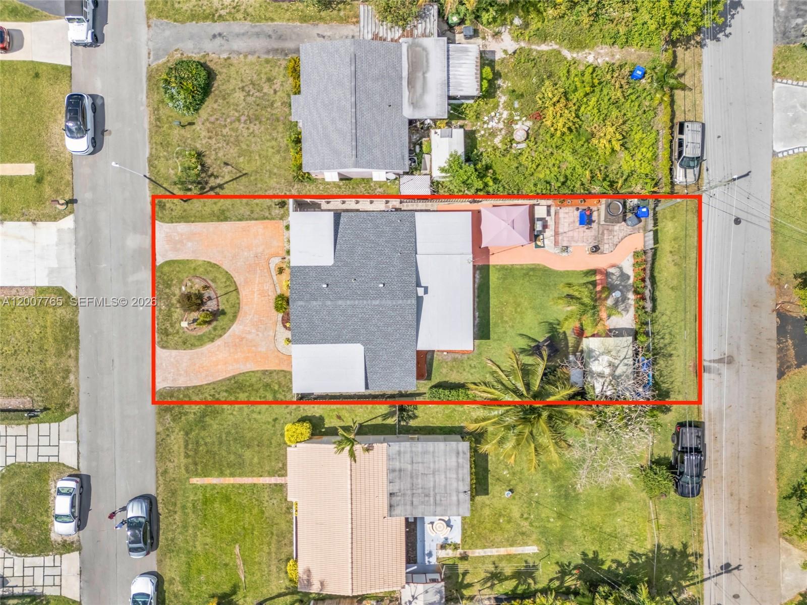 An aerial view shows a house with a driveway and backyard enclosed by a red border — 921 N 31st Ct, Hollywood FL 33021, HOLLYWOOD, FL