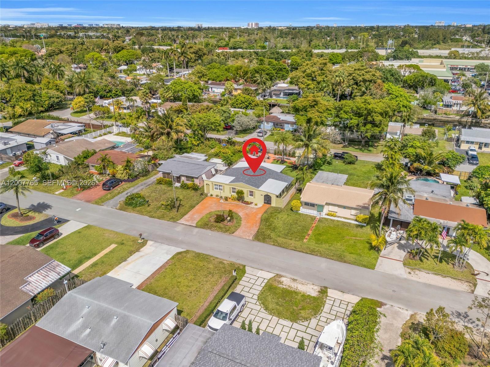 An aerial view shows a single-story house with a red location pin on its roof — 921 N 31st Ct, Hollywood FL 33021, HOLLYWOOD, FL