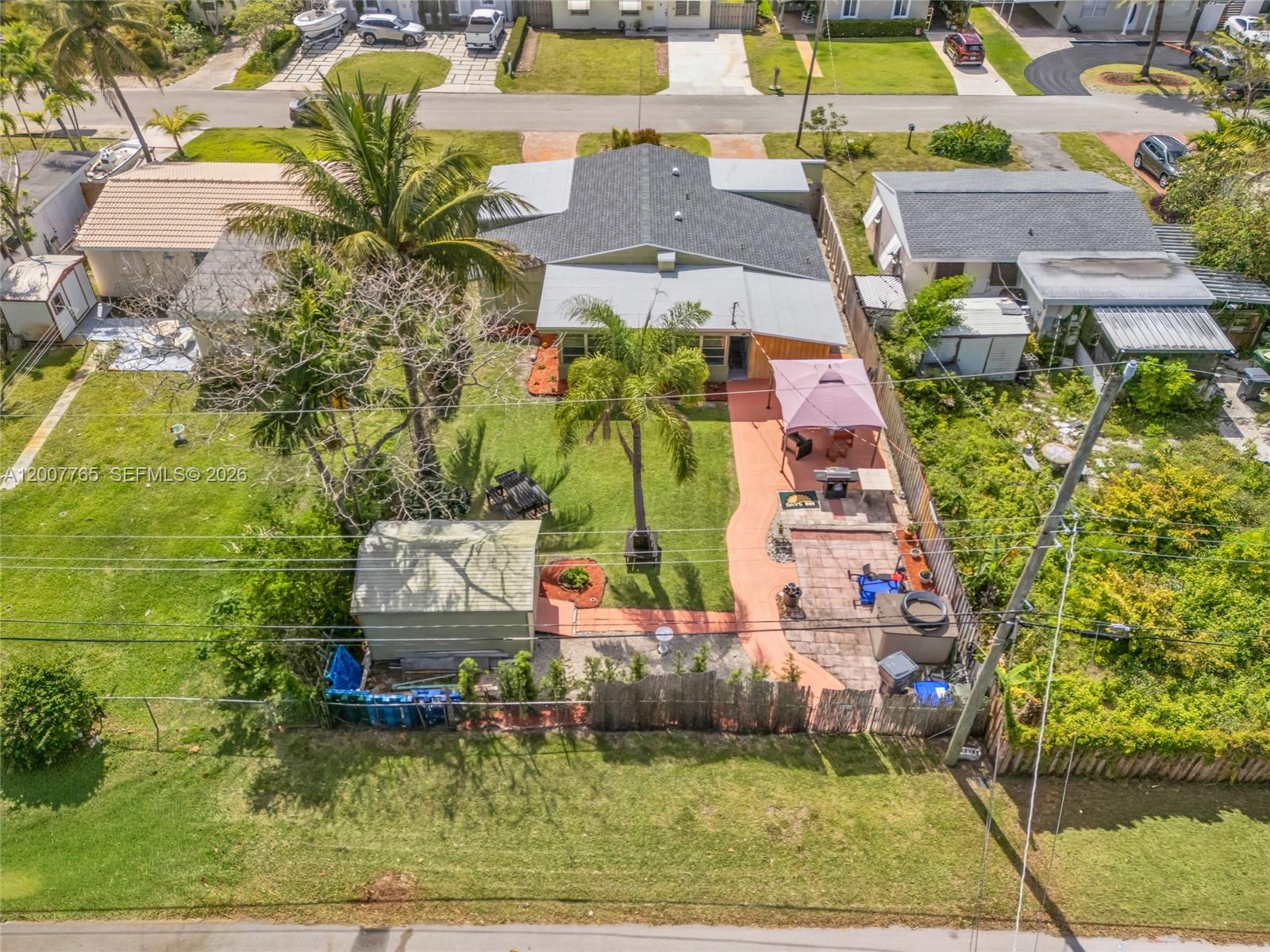 An aerial view shows a house with a backyard, patio, gazebo, and detached shed — 921 N 31st Ct, Hollywood FL 33021, HOLLYWOOD, FL