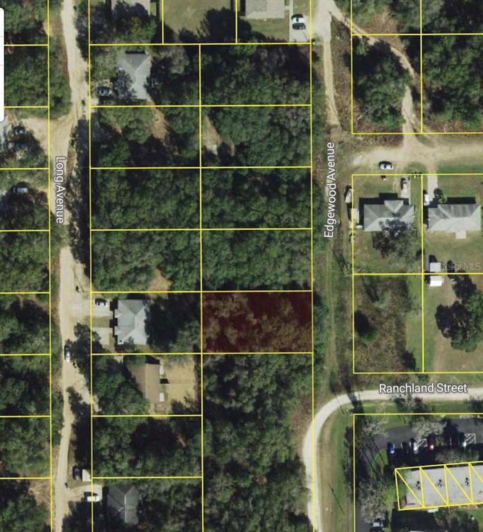 This is an aerial map showing a vacant, wooded residential lot highlighted in brown — 515 EDGEWOOD AVENUE, INVERNESS, FL