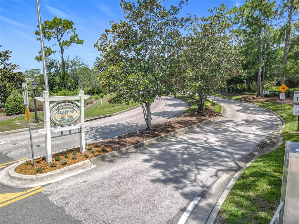 A sign for Victoria Cresswind stands at the entrance to a paved residential road — 600 GARDEN CLUB DRIVE, DELAND, FL