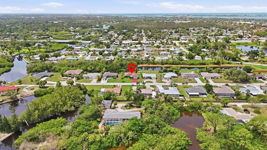 An aerial view shows a residential neighborhood with a red location pin on a house — 383 E WENTWORTH CIRCLE, ENGLEWOOD, FL