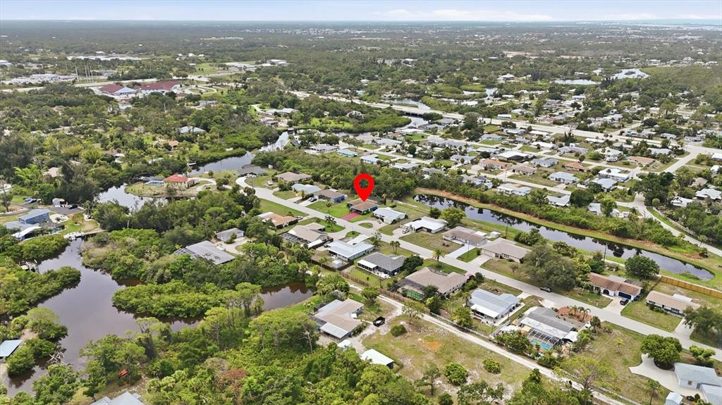 An aerial view shows a residential neighborhood with a red location pin over a house — 383 E WENTWORTH CIRCLE, ENGLEWOOD, FL
