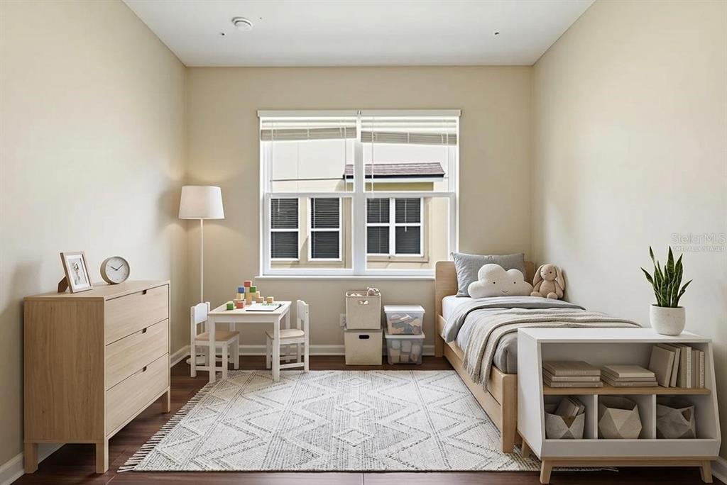 A child's bedroom features a twin bed, a small table with chairs, and a dresser — 207 MANOR VIEW LANE, DELAND, FL