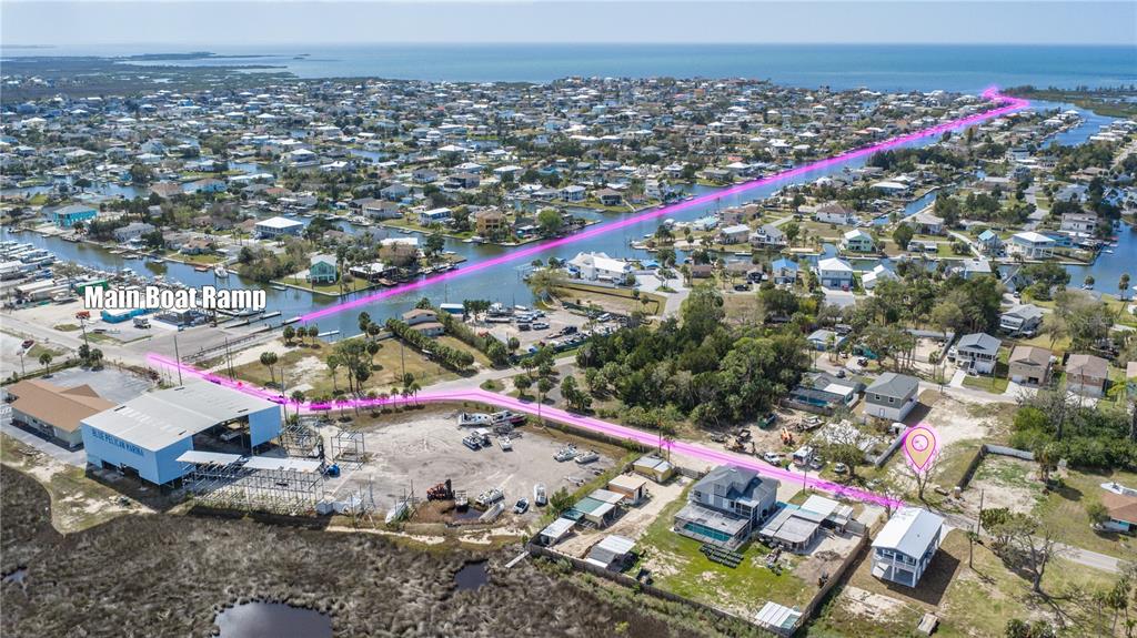 This aerial view shows a coastal neighborhood with a pink line highlighting a path — MAPLEWOOD DRIVE, HERNANDO BEACH, FL