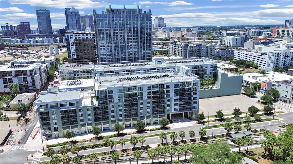 An aerial view of a modern multi-story apartment complex in a city setting — 912 CHANNELSIDE DRIVE UNIT 2805, TAMPA, FL
