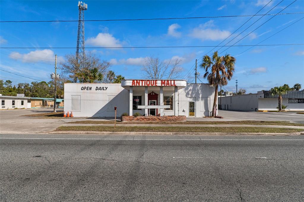 A single-story white building with an Antique Mall sign sits along a paved road — 103 NW US HIGHWAY 19, CRYSTAL RIVER, FL