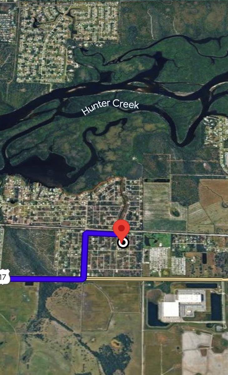 This is a satellite map showing a property location with a highlighted route near Hunter Creek — 140 Vanilla Cir, Punta Gorda FL 33982, PUNTA GORDA, FL