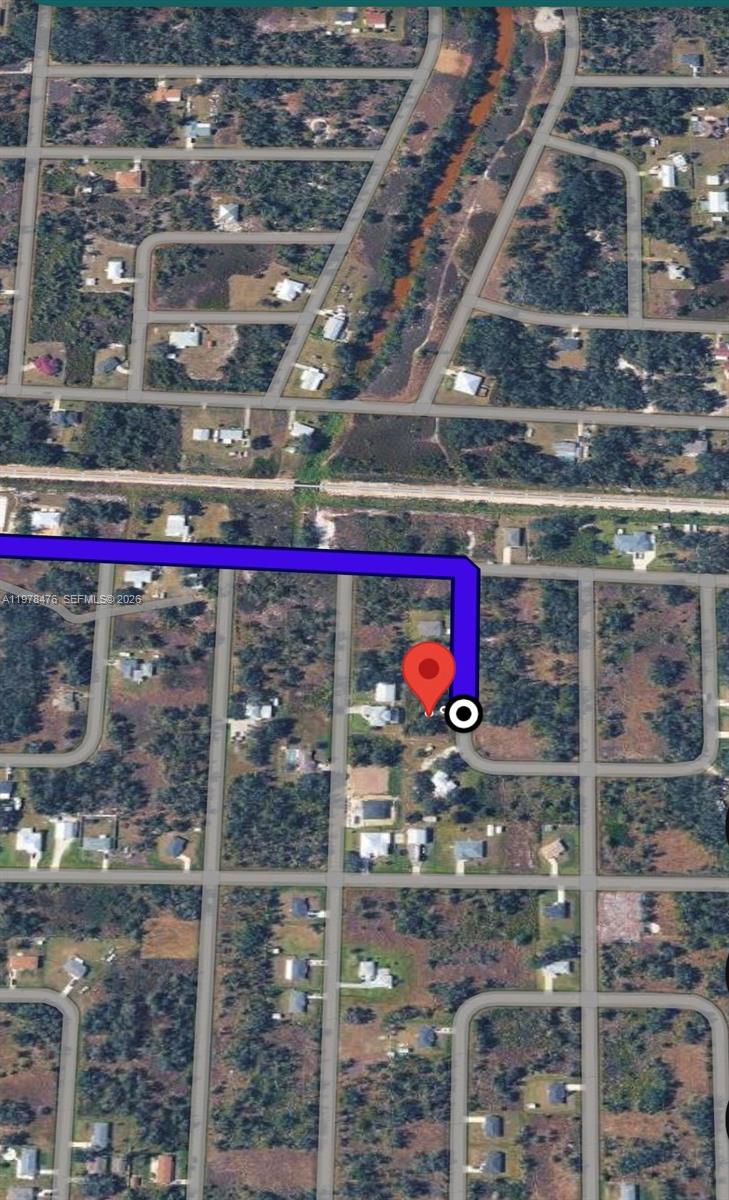 This is an aerial map view showing a residential property highlighted with a location pin — 140 Vanilla Cir, Punta Gorda FL 33982, PUNTA GORDA, FL
