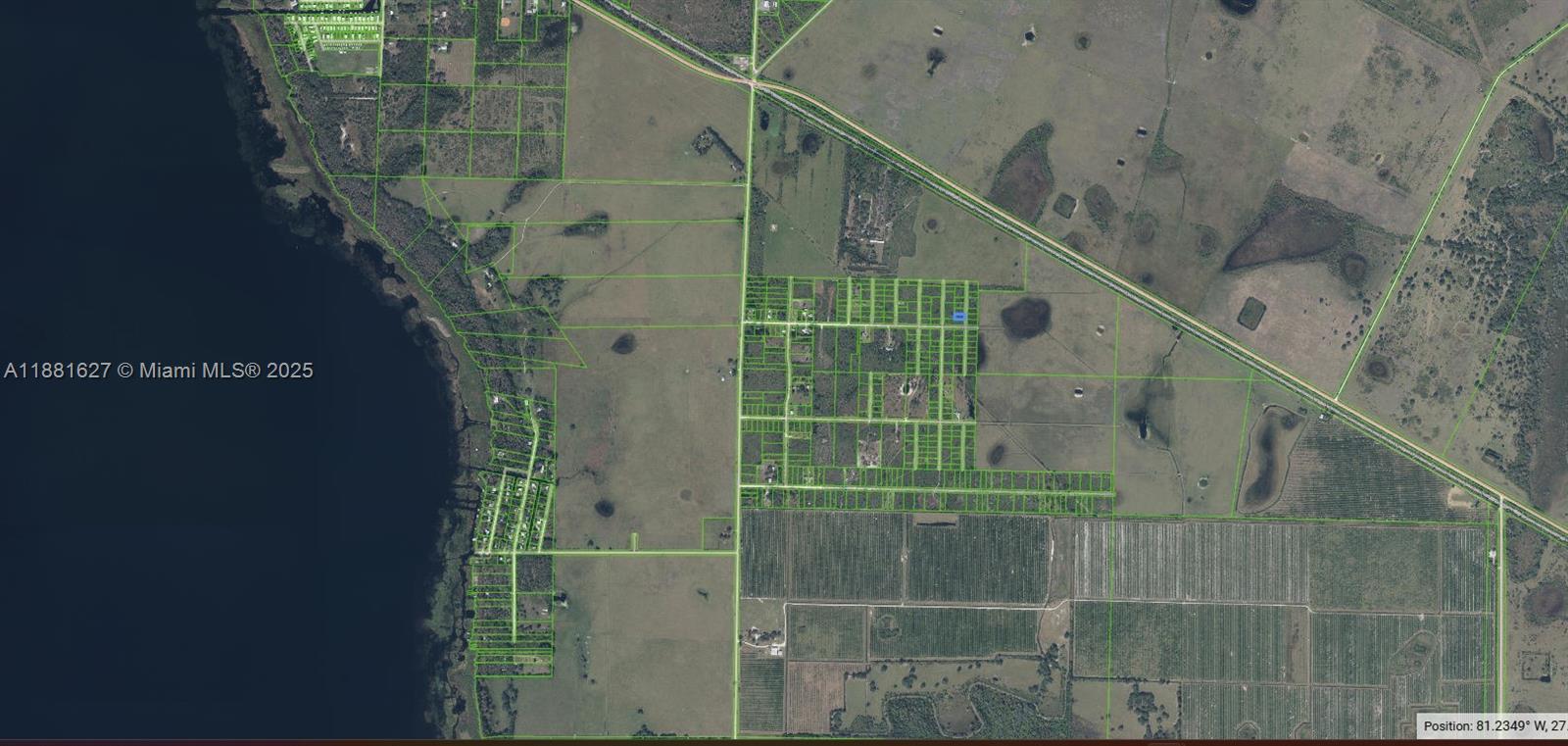 This is an aerial map showing land parcels and property boundaries near a large lake — 709 N Bronco Dr., Lorida FL 33857, LORIDA, FL