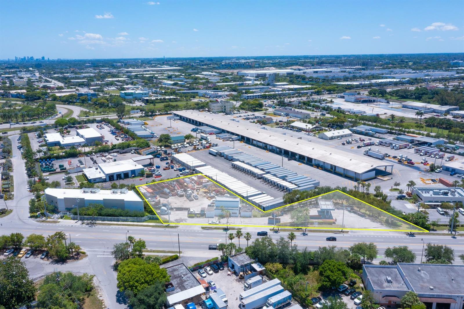 An aerial view shows a fenced industrial lot with a small building and parking area — 1126 Dr Martin Luther King Jr Boulevard, Pompano Beach FL 33069, POMPANO BEACH, FL