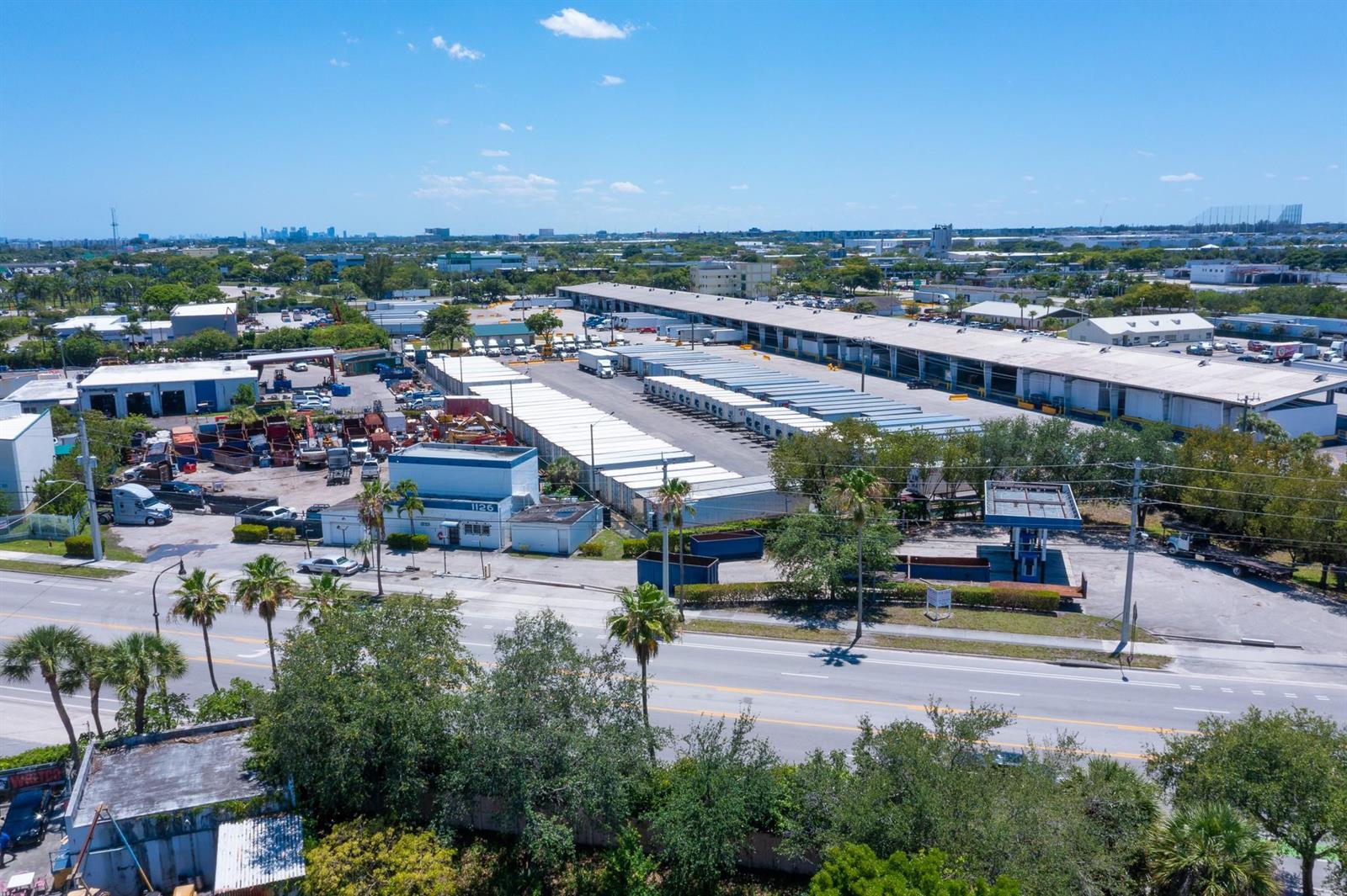 An aerial view of a large industrial warehouse facility with a parking lot and loading docks — 1126 Dr Martin Luther King Jr Boulevard, Pompano Beach FL 33069, POMPANO BEACH, FL