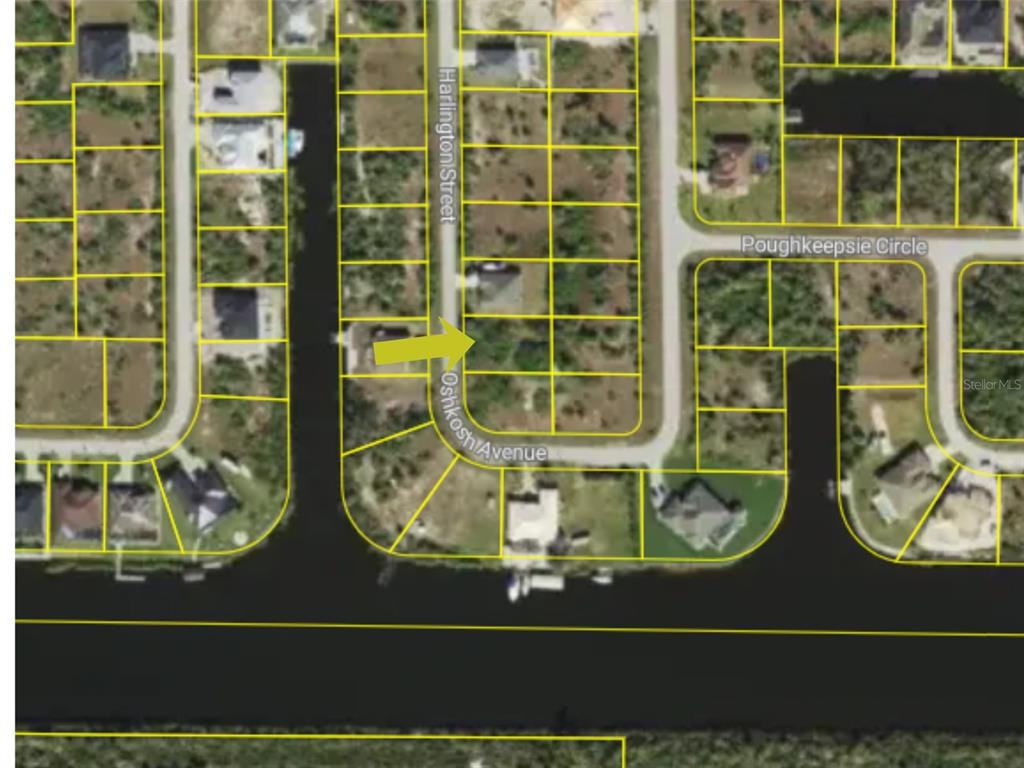 This is an aerial map showing a vacant residential lot highlighted by a yellow arrow — 10484 HARLINGEN STREET, PORT CHARLOTTE, FL
