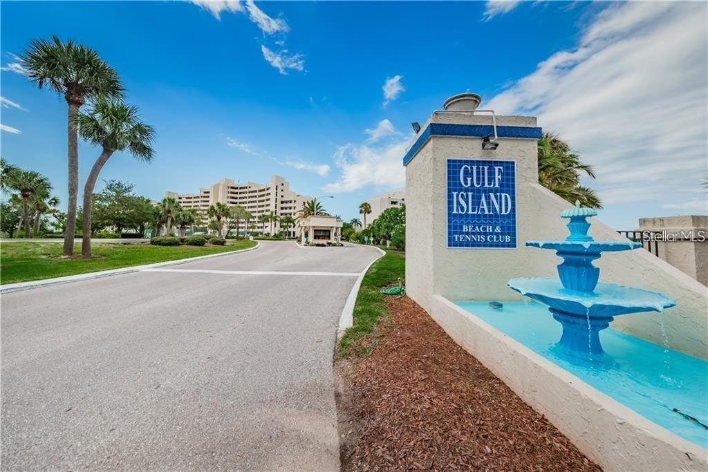 The entrance to the Gulf Island Beach & Tennis Club features a blue fountain — 5915 SEA RANCH DRIVE UNIT 503, HUDSON, FL