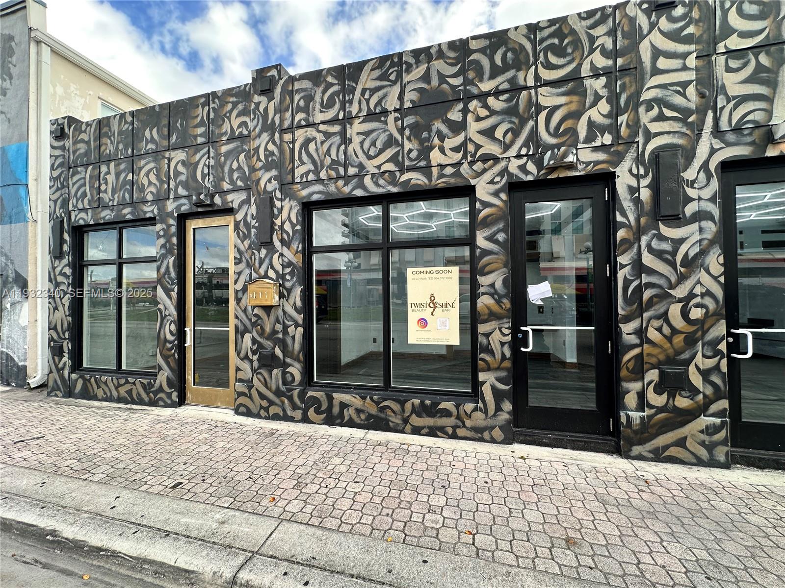 The exterior of a commercial building features a black and gold mural and glass storefronts — 111 S 21 Ave, Hollywood FL 33020, HOLLYWOOD, FL