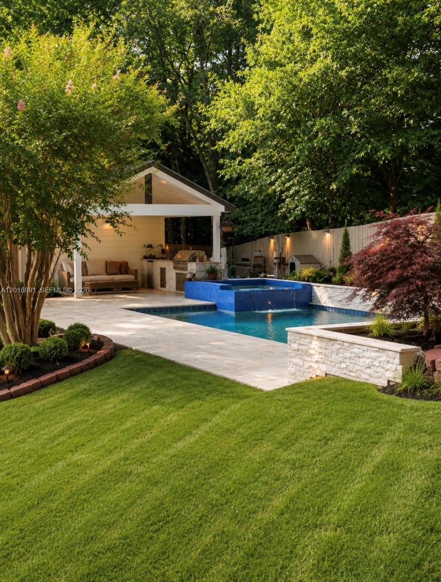 A backyard features a swimming pool with a blue-tiled spa and an adjacent covered patio — 1393 Sutters Walk, GA 30045, GA