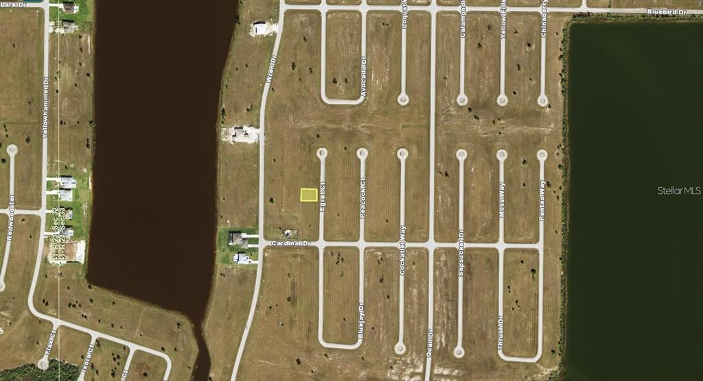An aerial map view shows a vacant residential lot highlighted in a suburban neighborhood — 7 EGRET COURT, PLACIDA, FL