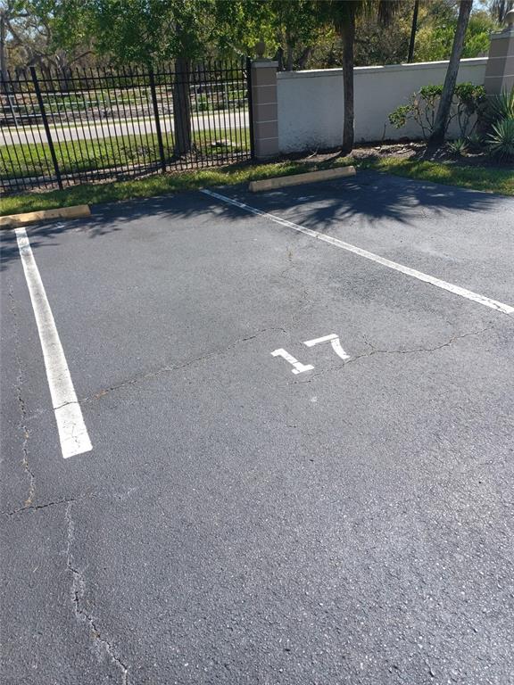 An outdoor parking space marked with the number 17 on the asphalt — 245 S MCMULLEN BOOTH ROAD UNIT 17, CLEARWATER, FL