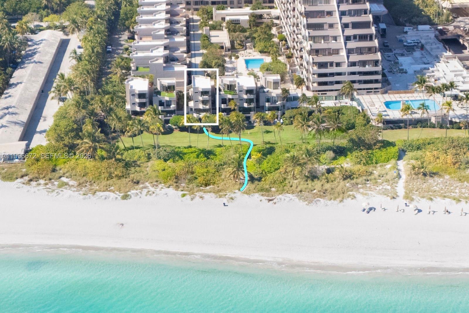 An aerial view shows a multi-story residential building with a private beach access path — 201 Crandon Blvd # 174, Key Biscayne FL 33149, KEY BISCAYNE, FL