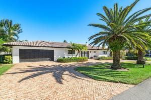 A single-story white house with a dark garage door and a brick driveway — 2700 Spanish River Road, Boca Raton FL 33432, BOCA RATON, FL