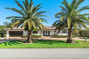 A single-story house with a brown garage and two large palm trees in the front yard — 2700 Spanish River Road, Boca Raton FL 33432, BOCA RATON, FL
