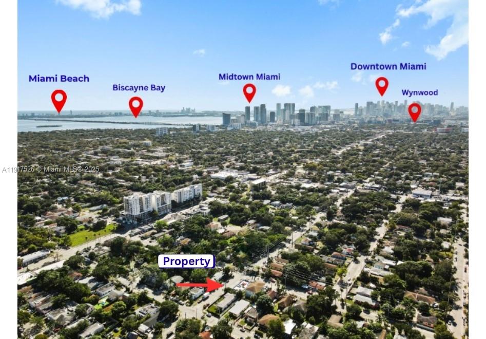 This aerial view shows a residential neighborhood with labeled landmarks and the bay beyond — 305 NW 58th St, Miami FL 33127, MIAMI, FL