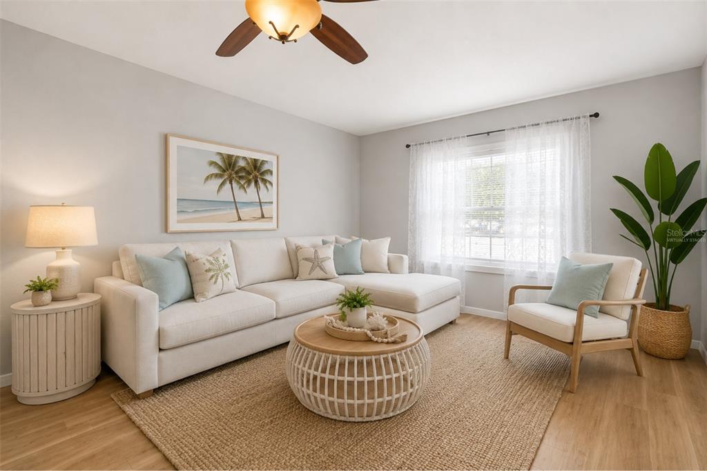 A living room features a sectional sofa, a round coffee table, and a wooden armchair — 3469 JANET STREET, APOPKA, FL