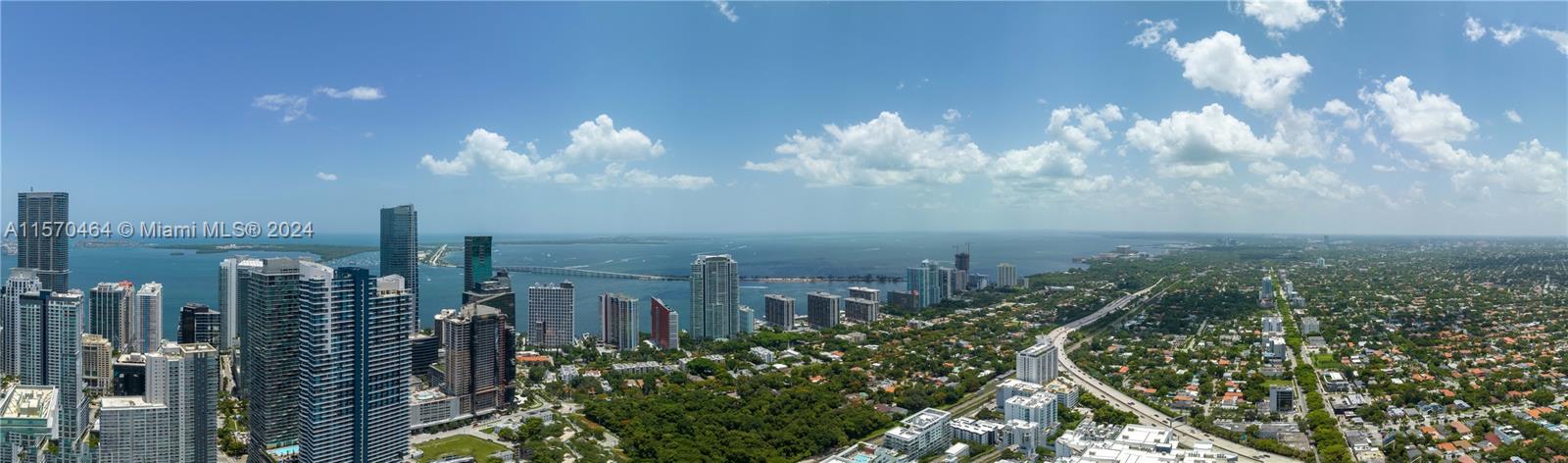 An aerial panoramic view shows high-rise buildings, a bay, a bridge, and surrounding residential areas — 1133 SW 2nd Ave # 5610, Miami FL 33130, MIAMI, FL