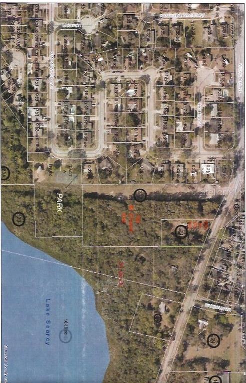This is an aerial map showing residential lots, a park, and Lake Searcy — 700 WEST CHURCH AVENUE, LONGWOOD, FL