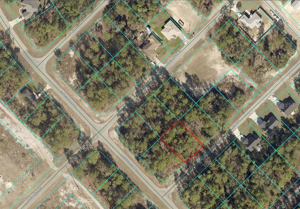 This is an aerial map showing a vacant, wooded residential lot outlined in red — TBD SW 150TH PLACE, OCALA, FL