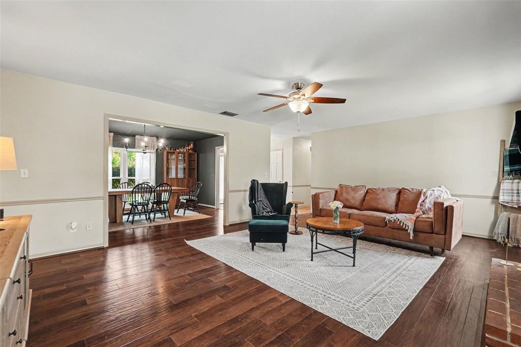 A single-story brick house with a gray roof, front lawn, and attached garage — 112 W BRENTRIDGE DRIVE, BRANDON, FL